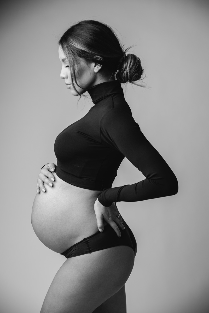 Boise modern maternity — black-and-white profile portrait in a fitted black turtleneck