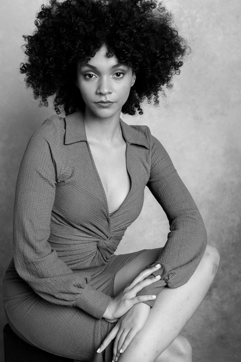 Boise portrait photographer — black and white seated portrait of a woman in a fitted dress